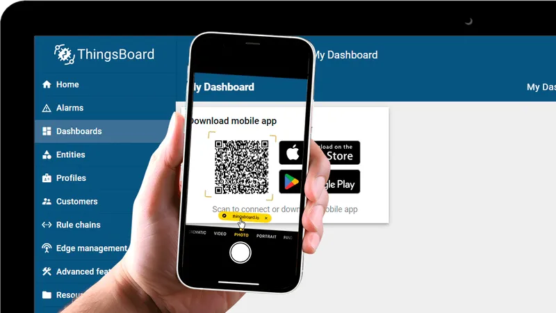 Hand holding a phone showing the QR code widget on the dashboard with store badges visible