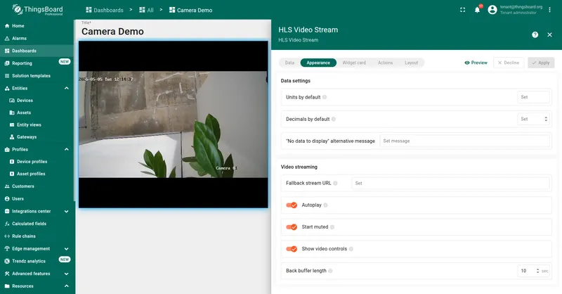 HLS Video Stream widget edit panel on the Appearance tab. The Video streaming section shows the Fallback stream URL field, Autoplay, Start muted, Show video controls toggles, and the Back buffer length field set to 10 seconds. The dashboard preview on the left plays a live HLS feed.