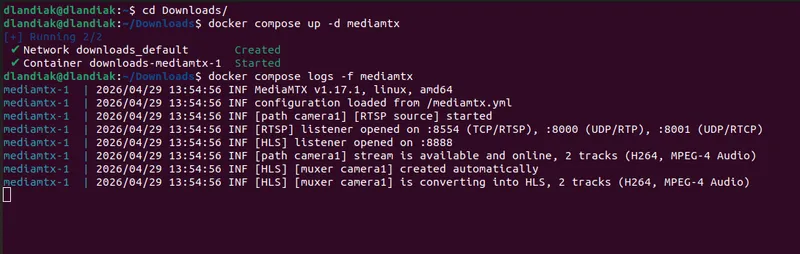 Terminal showing MediaMTX logs after docker compose up. The path camera1 line reports the stream as available and online with H264 and MPEG-4 Audio tracks; the HLS muxer is created and converts both tracks.